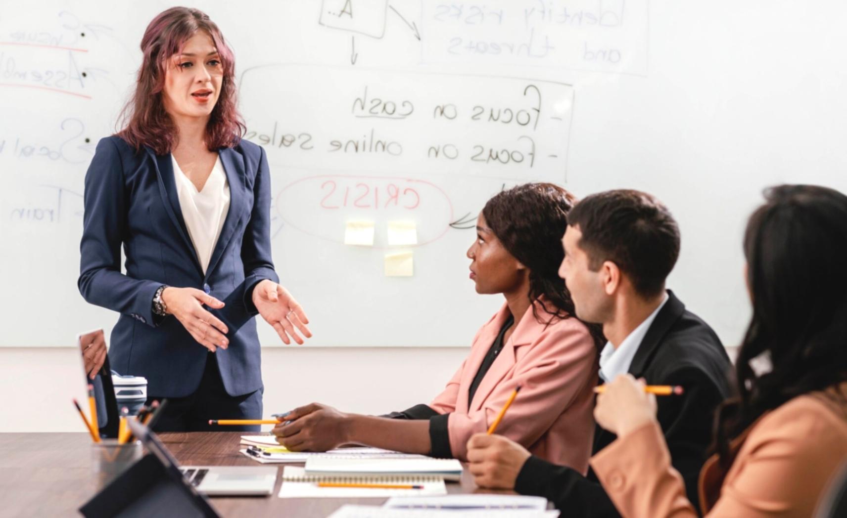 Team reviewing customer feedback data on multiple screens